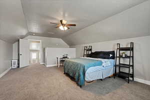 Bonus Room with baseboards, ceiling fan, a textured ceiling, carpet flooring, and vaulted ceiling