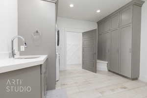 Enormous Laundry featuring recessed lighting, tons of storage & lockers