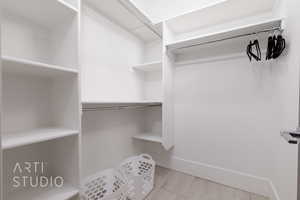 2nd Bedroom Spacious closet with wood look tile floors