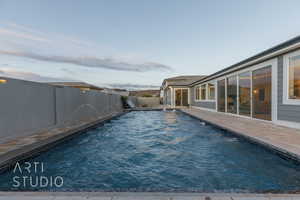 View of pool featuring a fenced in pool, a fenced backyard, and a patio area