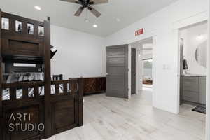 3rd Bedroom with recessed lighting, light wood look tile floors, and ensuite bath
