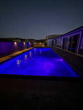 Pool at twilight with an outdoor pool