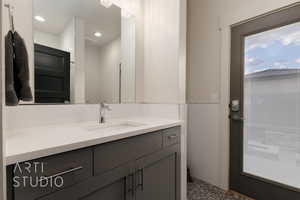 Pool Bathroom featuring recessed lighting, vanity, exterior entrance to pool deck & garage bedrooms