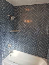 Bathroom featuring shower / bathing tub combination