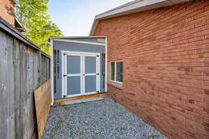 View of shed with fence