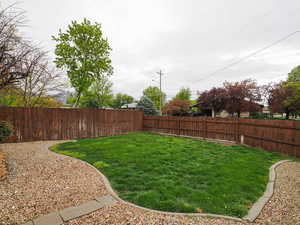 View of fully fenced front yard