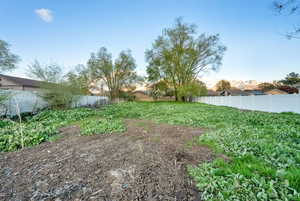 View of yard featuring fence