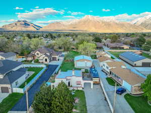 Drone / aerial view with a residential view and a mountain view