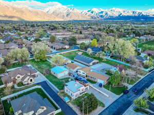 Birds eye view of property with a residential view and a mountain view