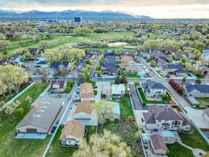 Birds eye view of property with a residential view, a mountain view, and golf course view