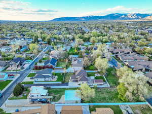 Drone / aerial view with a residential view and a mountain view
