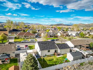 Drone / aerial view featuring a mountain view and a residential view AND The BRAND NEW ROOF :)