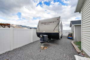 Exterior space with fence and a mountain view