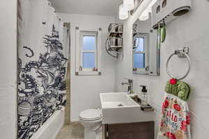 Full bath with toilet and vanity