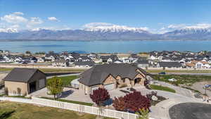 Birds eye view of property with a water and mountain view and a residential view