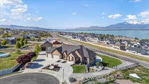 Birds eye view of property featuring a residential view and a water and mountain view