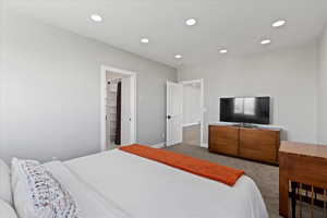Bedroom featuring carpet floors, baseboards, and recessed lighting