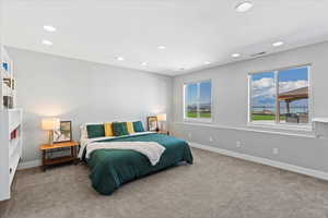 Bedroom featuring baseboards, carpet, recessed lighting, and visible vents