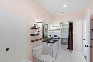 Full bathroom featuring visible vents, vanity, tile patterned floors, toilet, and recessed lighting