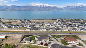 Birds eye view of property with a residential view and a water and mountain view