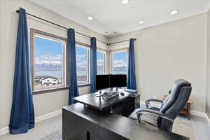 Office space with baseboards, recessed lighting, and light wood-style floors