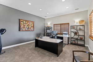 Office with baseboards, light carpet, and recessed lighting