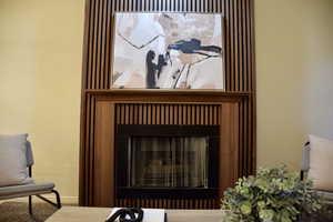 Details with baseboards and a fireplace
