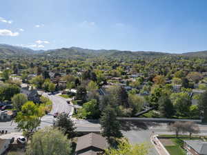 Birds eye view of property with a mountain view and a residential view