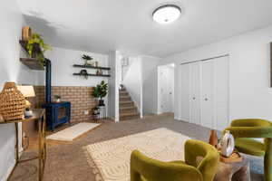Lower living room with sliding doors to the backyard