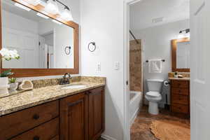 Primary bedroom vanity attached to shared bathroom