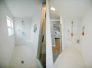 Full bath with a tile shower and ensuite bath