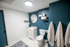Bathroom with toilet and vanity