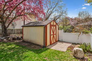 View of shed featuring a fenced backyard