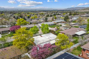 Drone / aerial view with a residential view and a mountain view