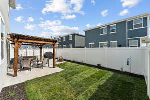 View of yard with an outdoor living space, a fenced backyard, a patio area, and a pergola