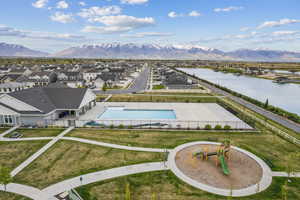 Drone / aerial view with a water and mountain view and a residential view