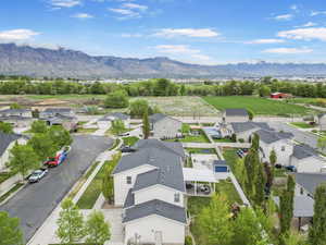 Birds eye view of property featuring a mountain view and a residential view