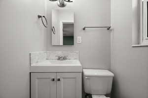 Bathroom with vanity and toilet
