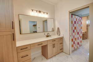 Full bathroom with vanity, a shower with curtain, and marble finish floor