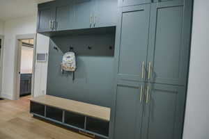 Mudroom with visible vents and light wood-style flooring