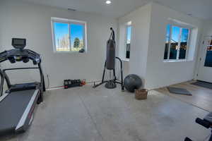 Exercise area with recessed lighting and a healthy amount of sunlight