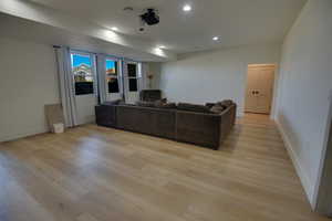 Living room featuring recessed lighting, baseboards, light wood finished floors, and visible vents