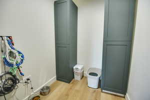 Details with baseboards and wood finished floors