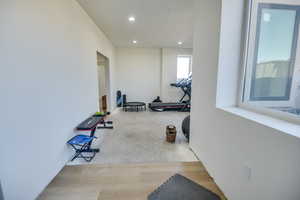 Workout area featuring recessed lighting
