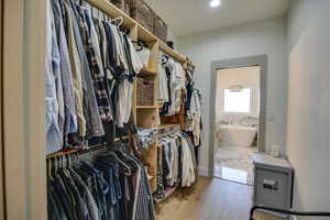 Spacious closet featuring wood finished floors