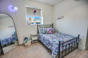 Bedroom with carpet floors and baseboards