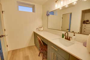 Bathroom with vanity and wood finished floors