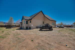 Rear view of house featuring fence