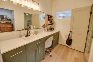 Bathroom with vanity and wood finished floors