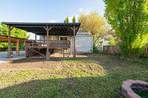 View of yard featuring fence and stairs